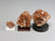 Back view, Three different sizes of aragonite crystal clusters on stands with a pencil for scale; dollhouse miniatures
