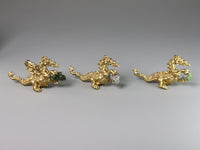 Three gold dragon figurines holding birthstones, dollshouse miniatures