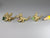 Three gold dragon figurines holding birthstones, dollshouse miniatures