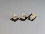 Side view, Three fossil jaws with teeth, dollhouse displays