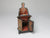 Interior of 1:12 scale Hinderloopen potty chair for dollhouse