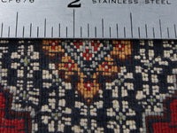 Back of rug with ruler for knot counting