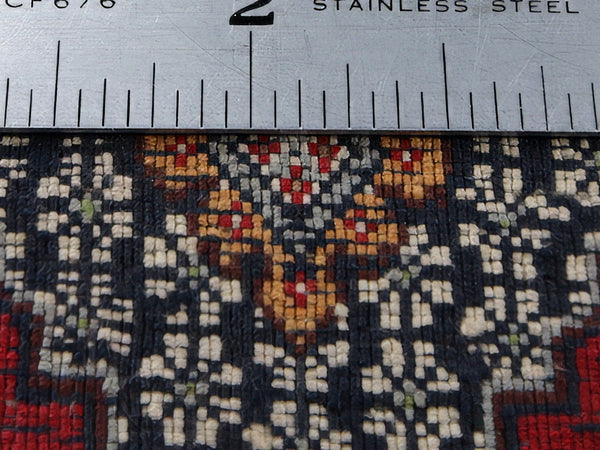 Back of rug with ruler for knot counting