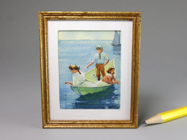 Framed miniature painting of children in a boat on water with a gold frame.