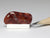 Polished red agate dollhouse miniature display