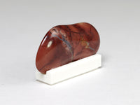 Side view, polished red agate miniature specimen