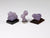 Three tiny specimens of purple grape agate