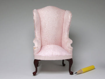 Pink upholstered wingchair, as is.  Bespaq?