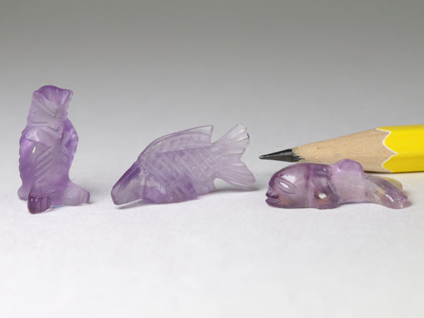 Tiny amethyst owl, fish & whale carvings