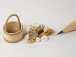 Miniature egg basket with tiny sea shells
